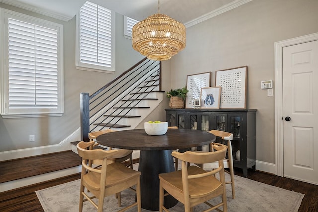 dining space featuring stairway, baseboards, dark wood-style flooring, crown molding, and a notable chandelier