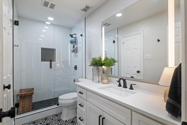 bathroom with visible vents, a stall shower, toilet, and vanity