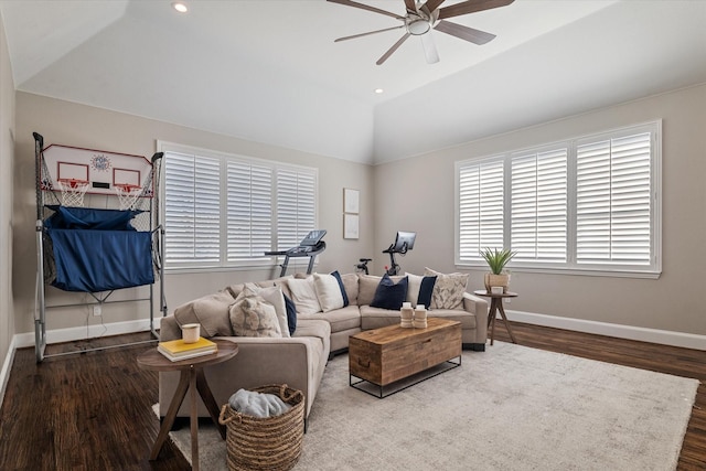 living room with lofted ceiling, wood finished floors, recessed lighting, baseboards, and ceiling fan