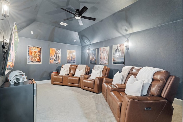 home theater room featuring visible vents, baseboards, carpet, lofted ceiling, and ceiling fan