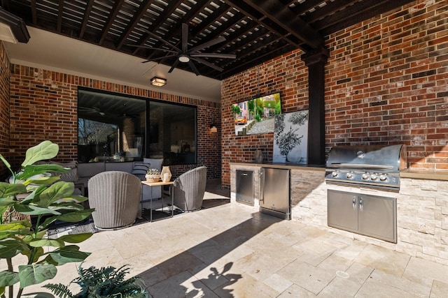 view of patio with area for grilling, a grill, and ceiling fan