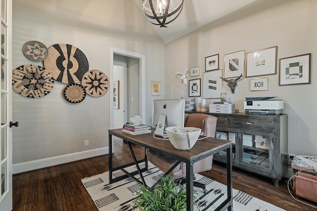 home office with a notable chandelier, lofted ceiling, baseboards, and wood finished floors