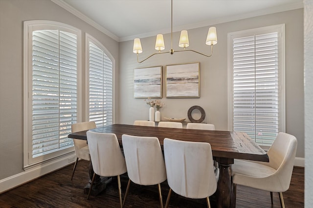 dining space featuring dark wood-type flooring, baseboards, and ornamental molding