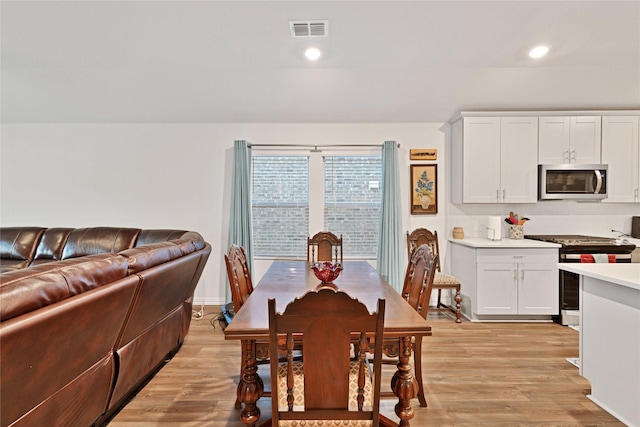 dining room with visible vents, recessed lighting, and light wood-style floors