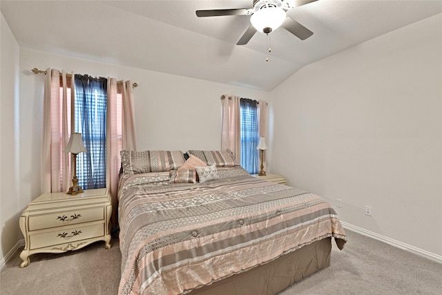 bedroom featuring vaulted ceiling, carpet flooring, a ceiling fan, and baseboards