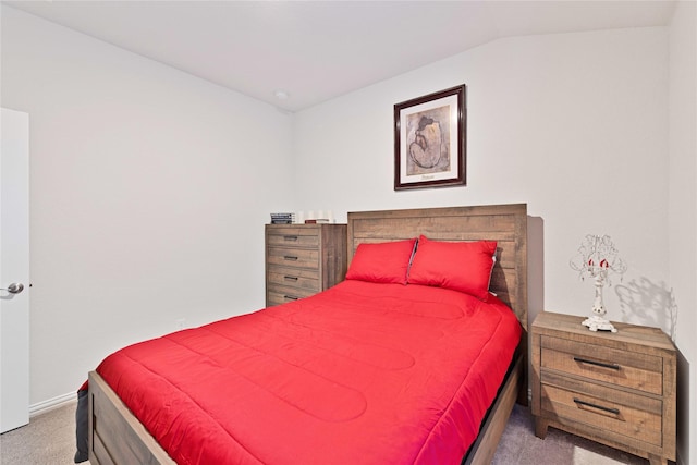 carpeted bedroom with vaulted ceiling