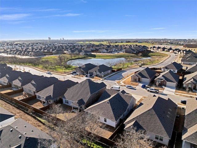 birds eye view of property with a residential view and a water view