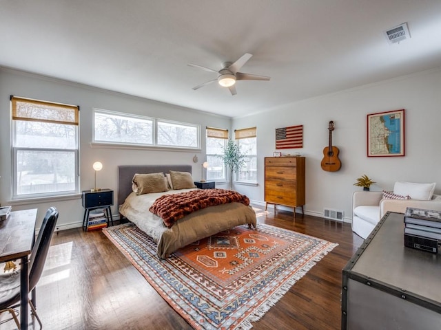 bedroom with baseboards, visible vents, and dark wood-style flooring