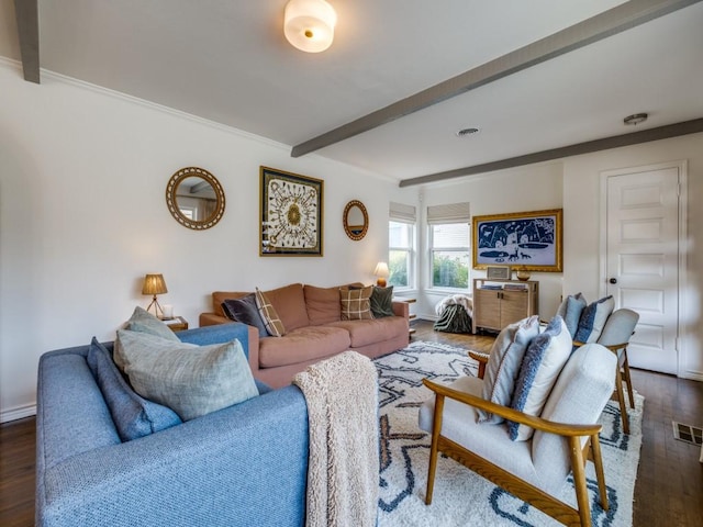 living area featuring beam ceiling, wood finished floors, baseboards, and visible vents