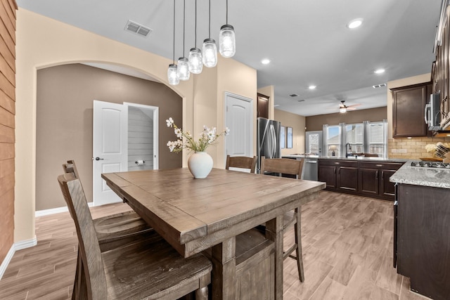 dining room featuring visible vents, recessed lighting, light wood finished floors, baseboards, and ceiling fan