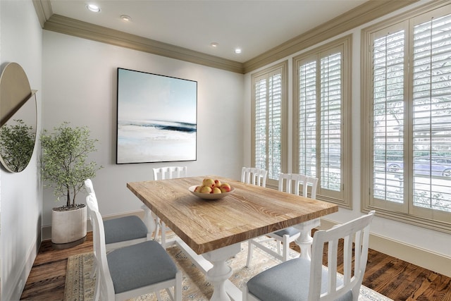 dining room featuring crown molding, recessed lighting, wood finished floors, and baseboards