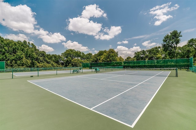 view of tennis court with fence