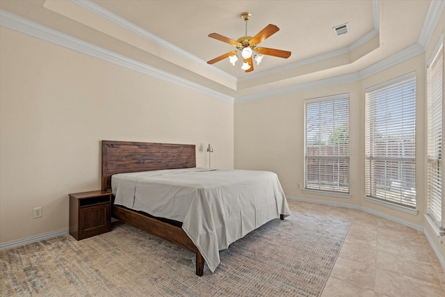 bedroom with visible vents, baseboards, light tile patterned flooring, crown molding, and a raised ceiling