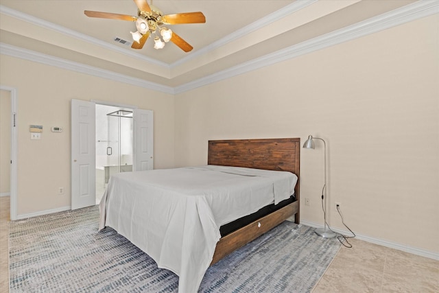 bedroom with visible vents, a raised ceiling, ensuite bathroom, crown molding, and baseboards