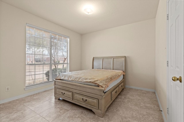 bedroom featuring baseboards