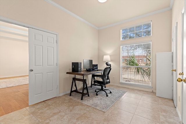 office area with light tile patterned flooring, baseboards, and ornamental molding