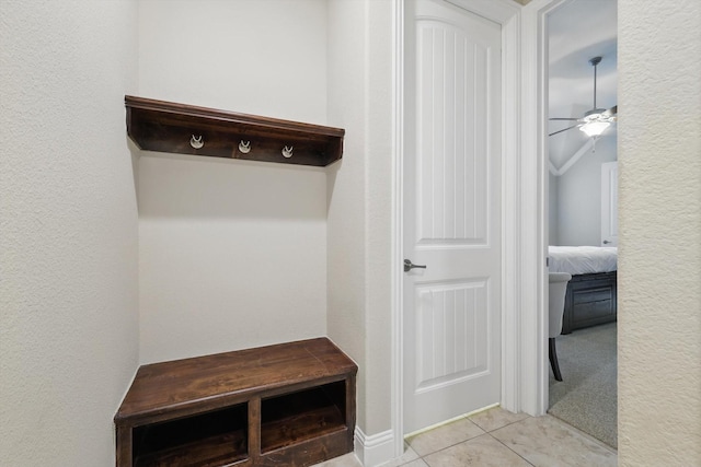 mudroom with light tile patterned floors and ceiling fan