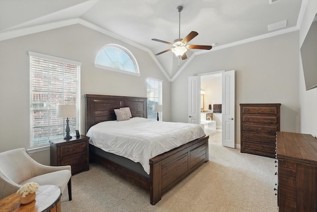 bedroom with visible vents, ornamental molding, connected bathroom, light colored carpet, and vaulted ceiling