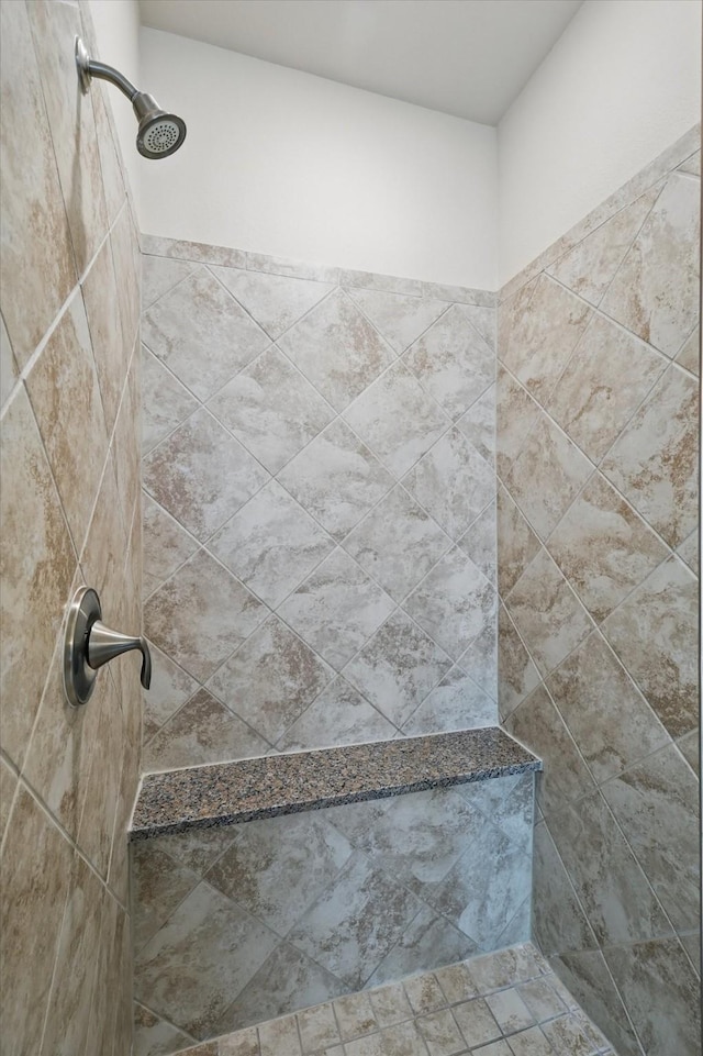 bathroom featuring tiled shower