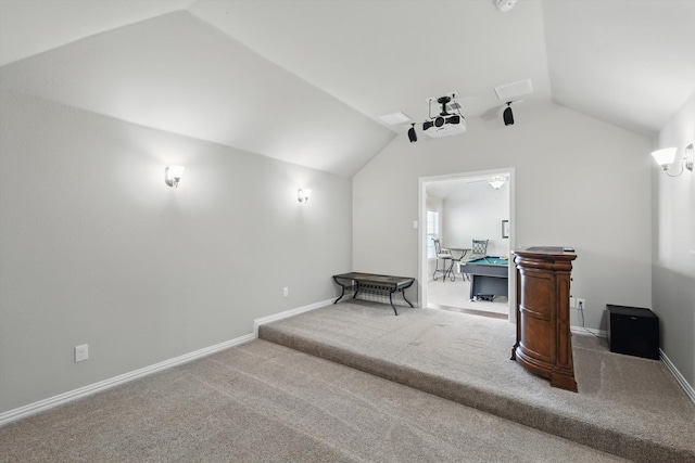 bonus room with lofted ceiling, baseboards, and carpet floors