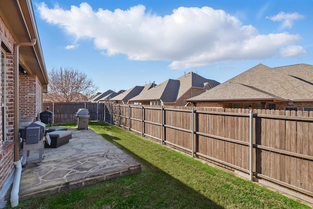 view of yard featuring a fenced backyard and a patio area