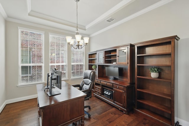 office space with dark wood finished floors, a raised ceiling, baseboards, and ornamental molding