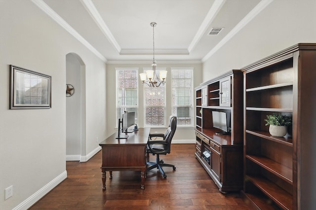 office space with dark wood finished floors, visible vents, crown molding, and a tray ceiling