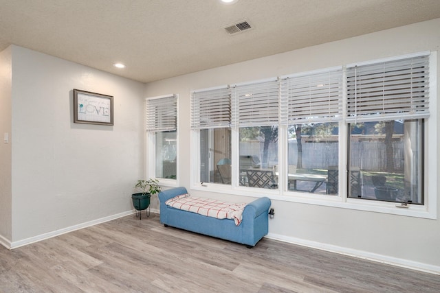 sitting room featuring recessed lighting, visible vents, baseboards, and light wood-style flooring