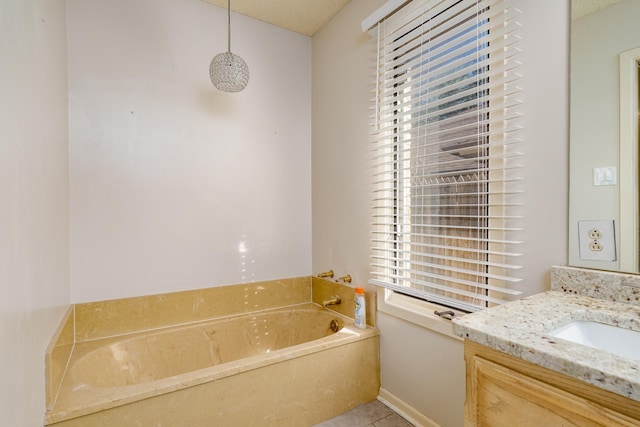 bathroom featuring a bath, vanity, and tile patterned flooring