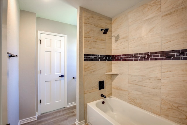 full bath with shower / tub combination, baseboards, and wood finished floors
