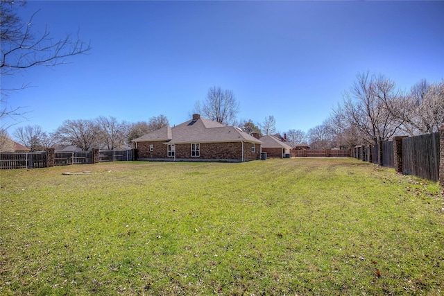 view of yard featuring a fenced backyard