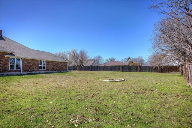 view of yard featuring a fenced backyard