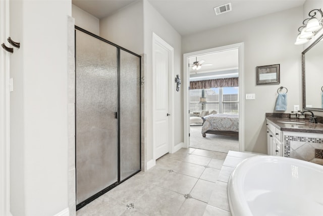 bathroom featuring visible vents, vanity, a stall shower, tile patterned floors, and ensuite bath