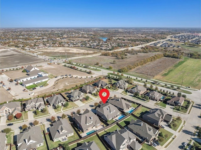 birds eye view of property with a residential view