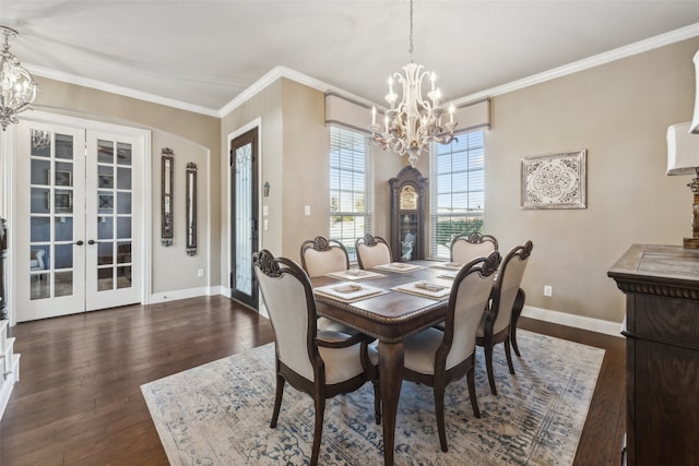 dining area featuring dark wood-style floors, a notable chandelier, and french doors