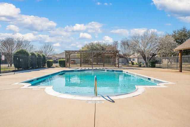 view of swimming pool featuring a patio area, a pergola, and fence