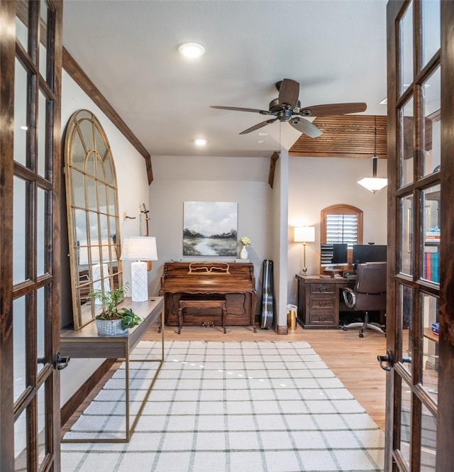 home office featuring wood finished floors, french doors, and ceiling fan