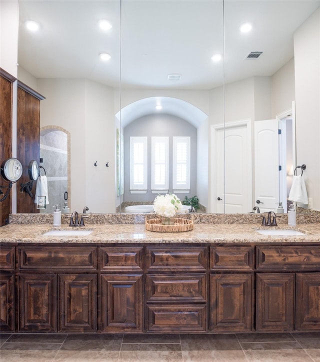 1300 Aberdeen Dr, Lucas, TX 75002 - full bathroom with double vanity, a walk in shower, and recessed lighting