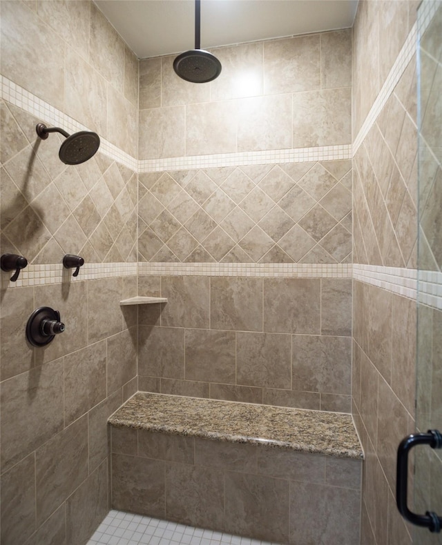 bathroom with a shower stall