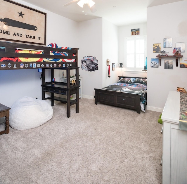 bedroom featuring baseboards, carpet, and ceiling fan