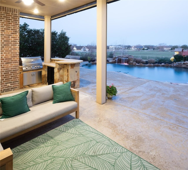 view of patio / terrace featuring ceiling fan, grilling area, area for grilling, and a swimming pool