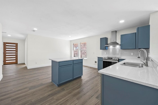 kitchen with electric range, a sink, a kitchen island, wall chimney range hood, and dark wood-style flooring