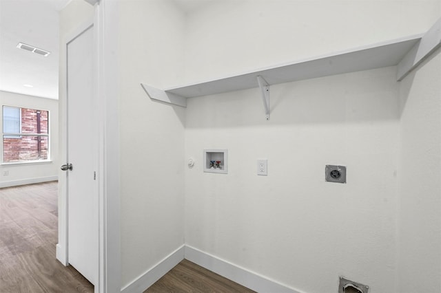 laundry area with visible vents, dark wood finished floors, laundry area, hookup for a washing machine, and electric dryer hookup