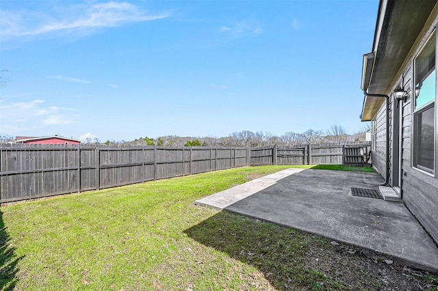 view of yard with a fenced backyard and a patio