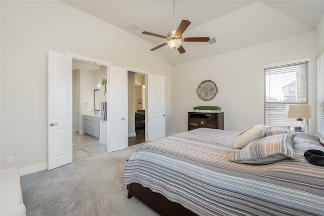 bedroom with visible vents, light carpet, a ceiling fan, connected bathroom, and lofted ceiling