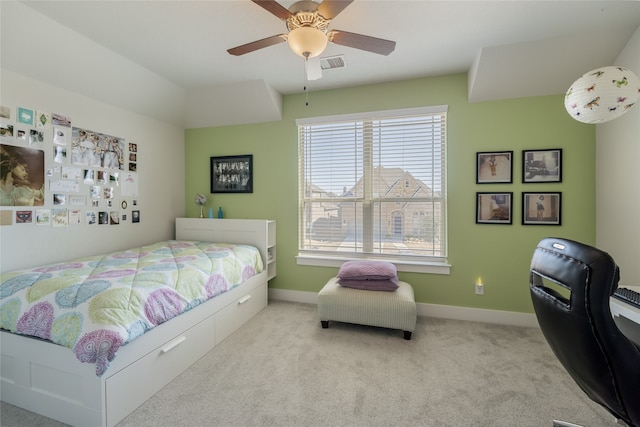 carpeted bedroom with baseboards, visible vents, and ceiling fan