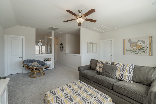 carpeted living room with visible vents, baseboards, attic access, ceiling fan, and vaulted ceiling