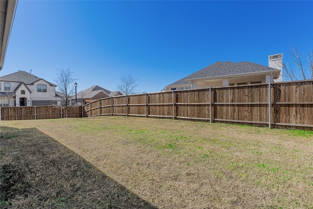 view of yard featuring a fenced backyard