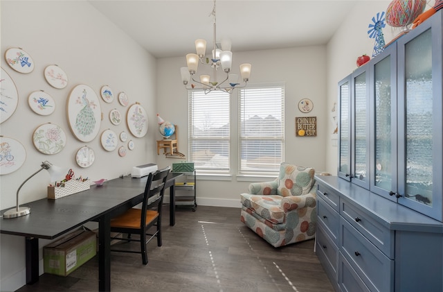 home office featuring a chandelier, baseboards, and dark wood finished floors