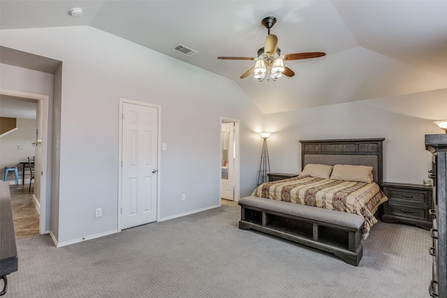 carpeted bedroom with baseboards, visible vents, a ceiling fan, and vaulted ceiling